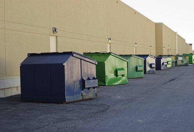 an overflowing dumpster filled with roofing shingles and other scraps from a construction project in Greenleaf, WI